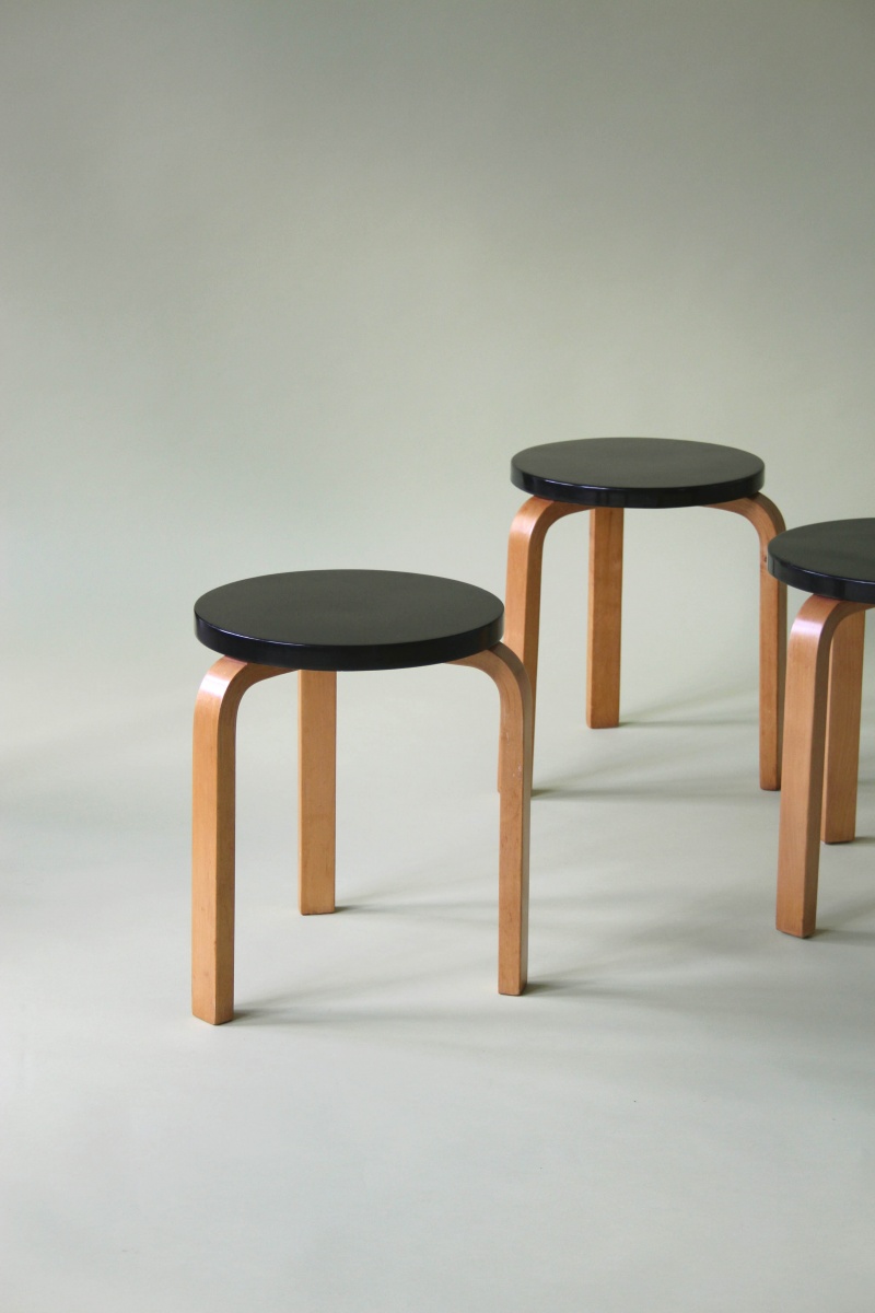 4 black topped stools by alvar aalto
