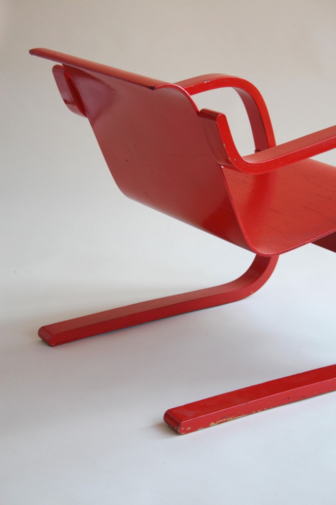Red cantilever armchair