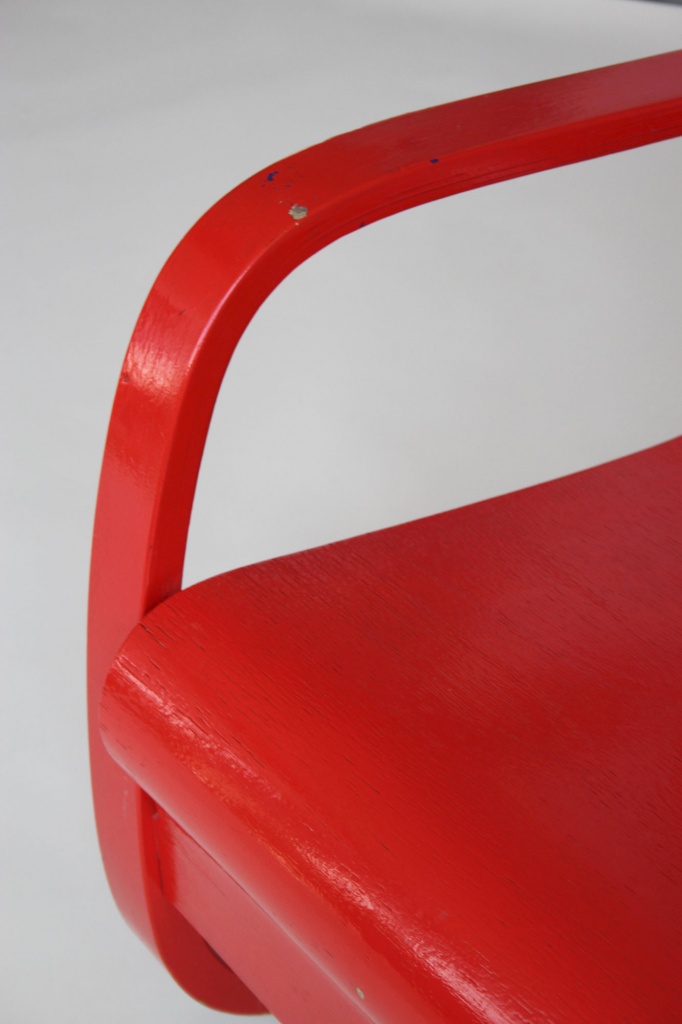 Red cantilever armchair