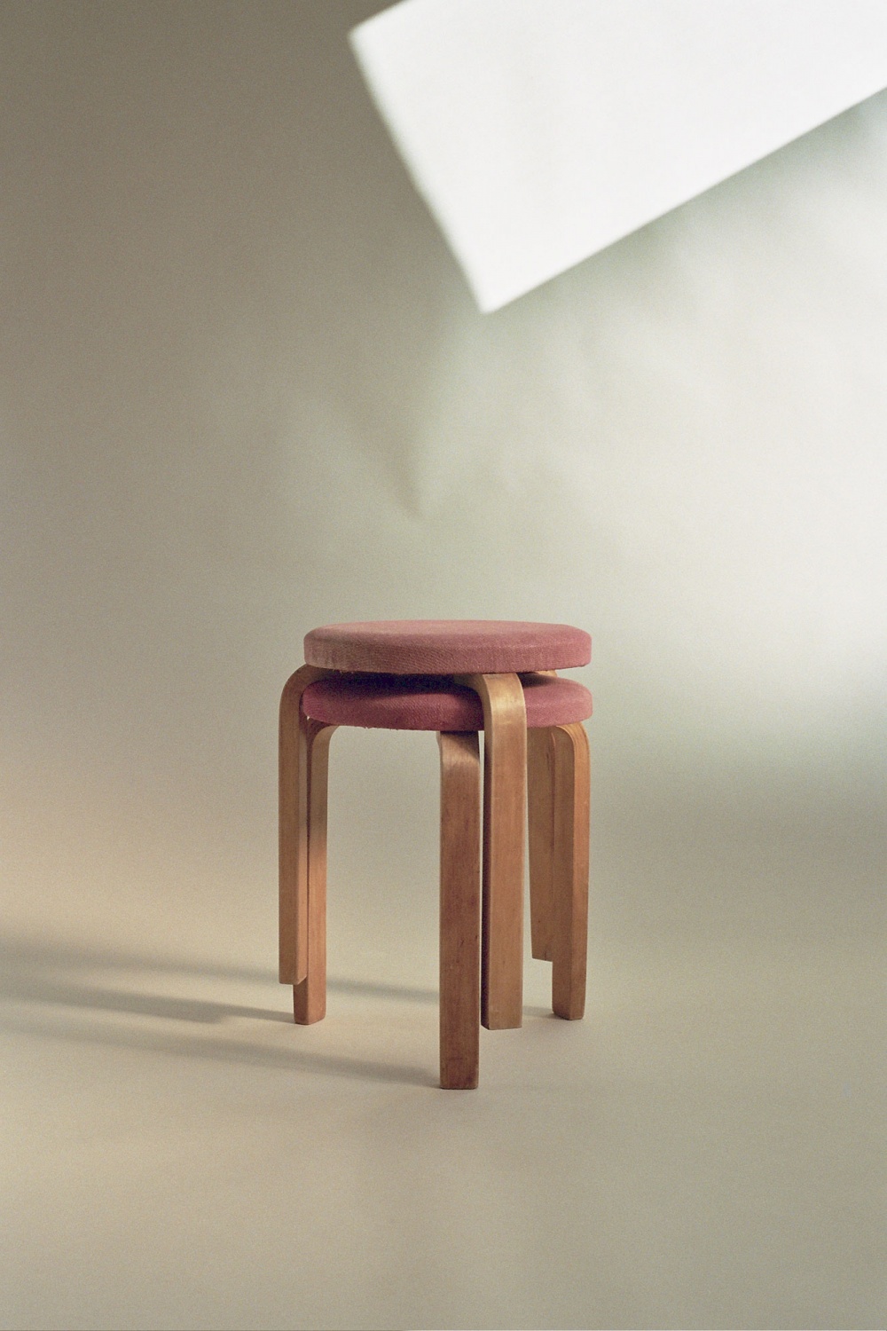 Alvar Aalto stools - upholstered in pink woven paper
